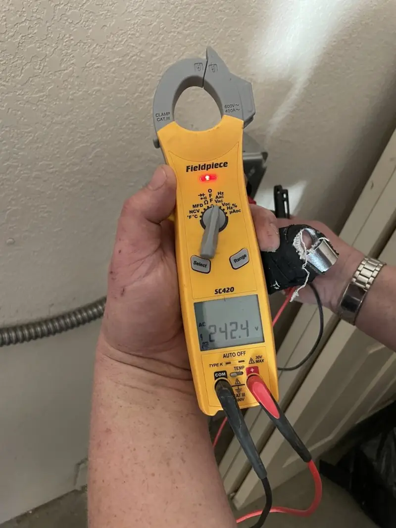 Voltage testing with clamp meter during Circuit Breaker Repair in Georgetown